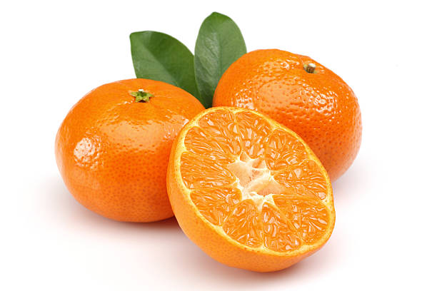 Tangerines with half tangerines on a white background stock photo