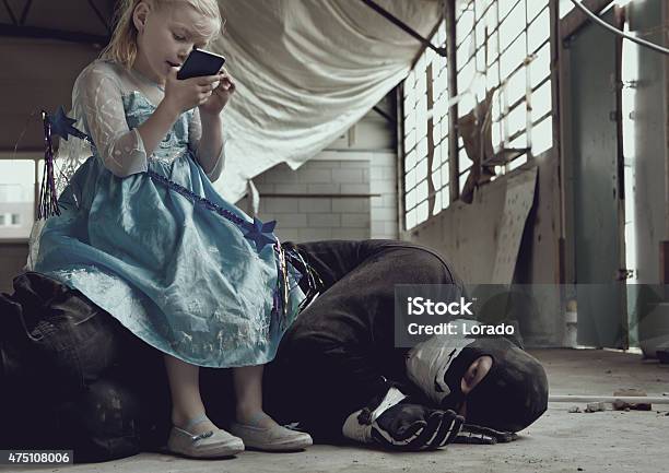 Girl Princess And A Masked Man Stock Photo - Download Image Now - 2015, Abandoned, Acting - Performance