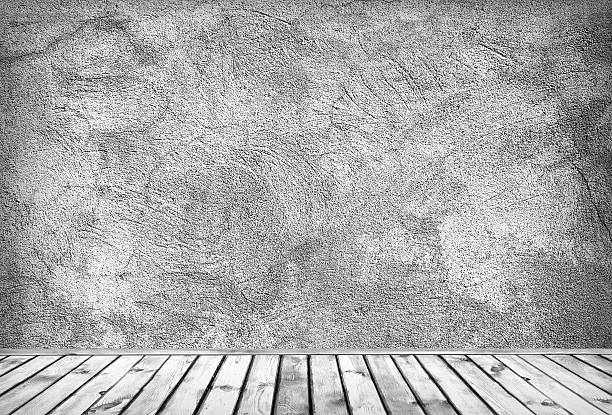 istock Empty grey dirty concrete wall and wooden floor 475112666