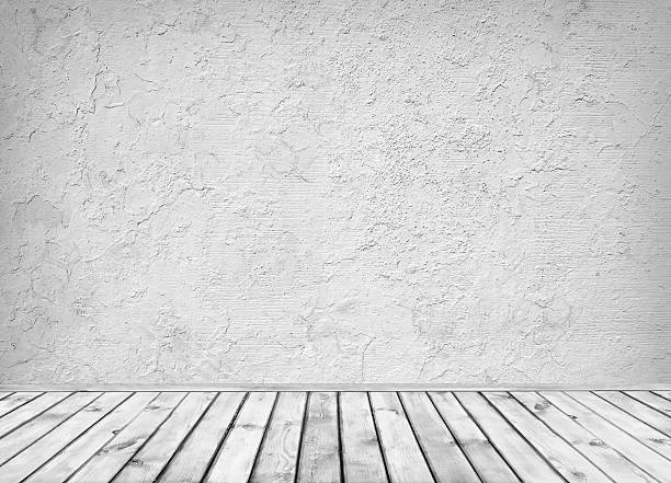 istock Empty grey dirty concrete wall and wooden floor 475112692