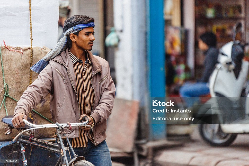 Rickshaw Driver at work in Old Delhi Old Delhi, India- March 3, 2015 : Rickshaw Driver at work in Old Delhi. 2015 Stock Photo