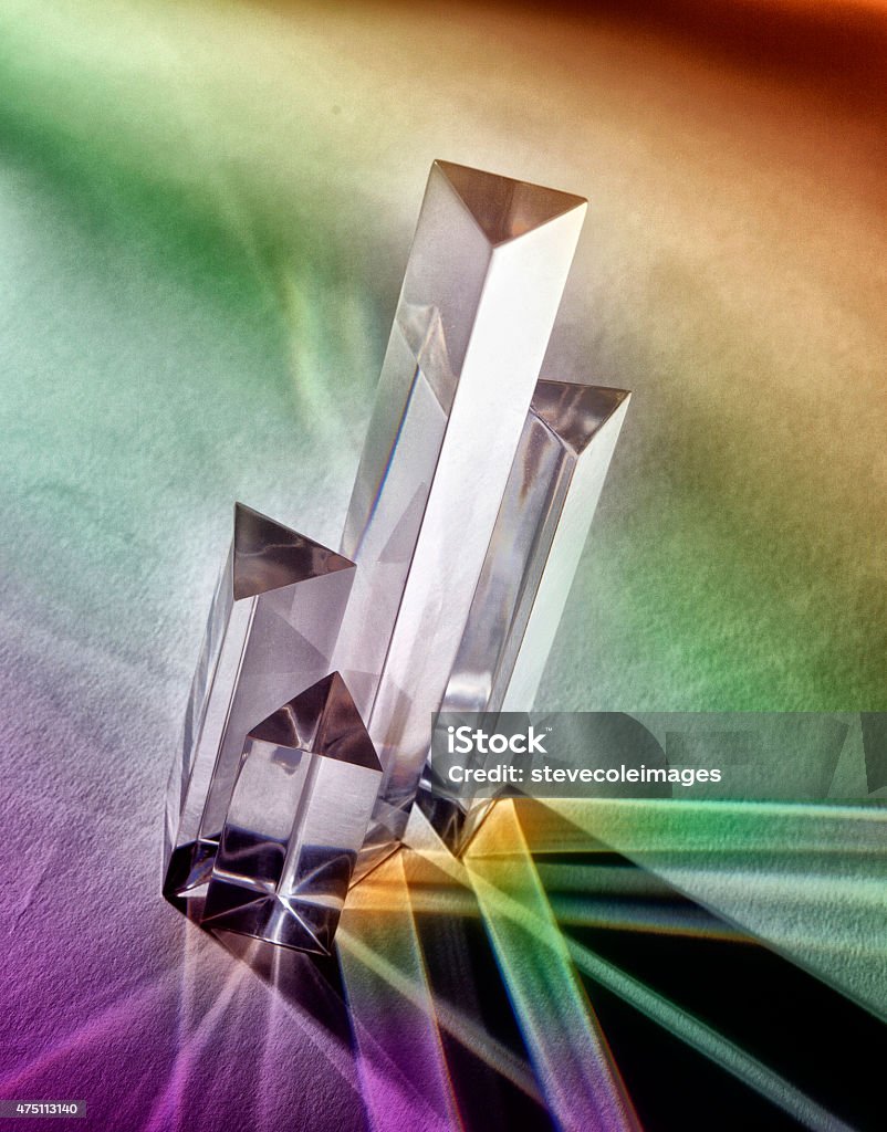 Crystal Prism Crystal prisms photographed on tabletop with rainbow shadows. Prism Stock Photo