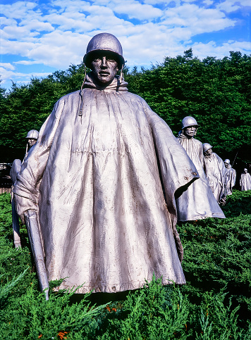 Washington, DC -July 11, 2015: Bronze statues at the Korean War Memorial in Washington DC show a platoon leader followed by the rest of his patrol. (Scanned from color slide film.)