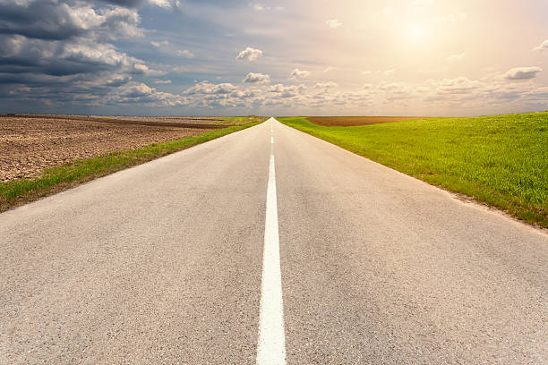 istock Driving on an empty asphalt road through the vastness 475114230