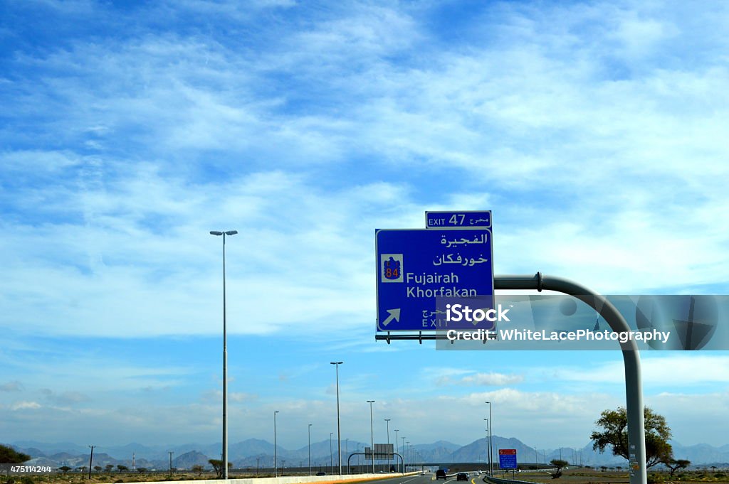 Road view in Sharjah-Kalba road with Road Direction Sign Board Road view in Sharjah-Kalba road with Road Direction Sign BoardRoad view in Sharjah-Kalba road with Road Direction Sign Board 2015 Stock Photo