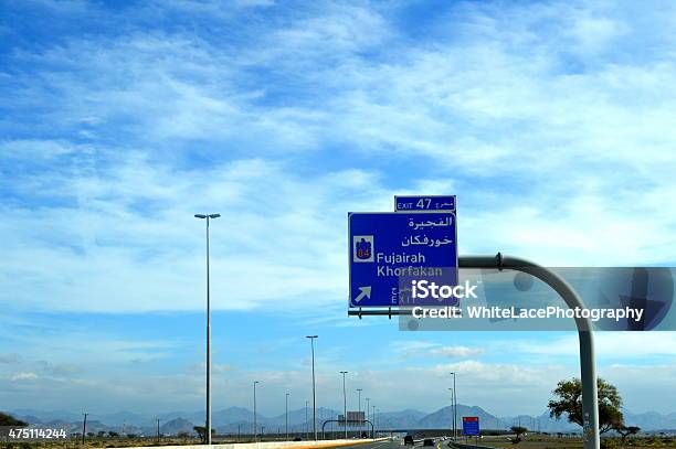 Road View In Sharjahkalba Road With Road Direction Sign Board Stock Photo - Download Image Now