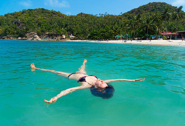 istock Young woman relax like a sea star 475114256