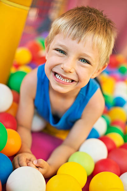istock Little boy in the ball pool 475114424
