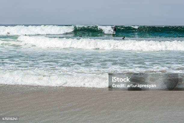Surfers Stock Photo - Download Image Now - Bay of Water, Beach, Breaking Wave