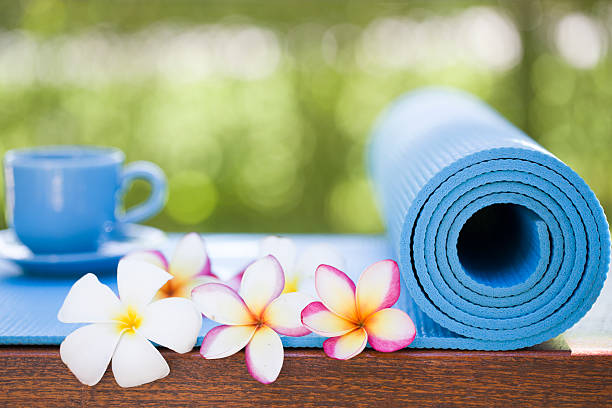 istock yoga mat and a cup of coffee 475115734