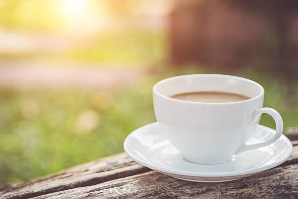 istock White coffee cup in the garden 475115976