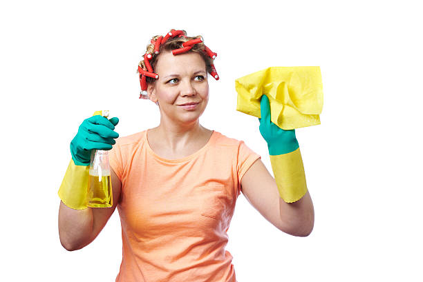 istock Housewife with rag wipe and cleaning spray 475117328