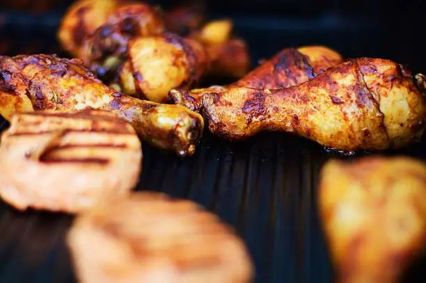 Chicken drumsticks on a barbecue