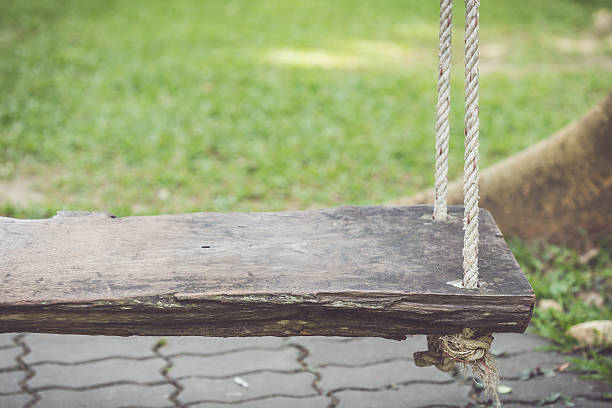 istock Old wooden swing in the garden 475118900