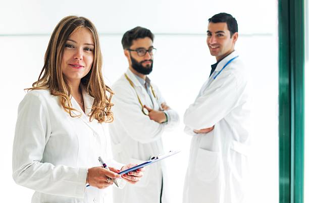 istock Woman Doctor. Teamwork on background 475122942