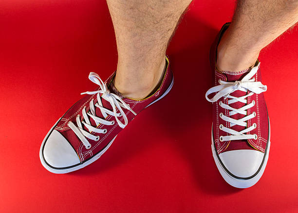 istock Feet and Red Canvas Trainers 475124626