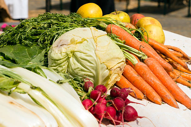istock Orange carrots yellow apples, radishes, savoy cabbage 475125106