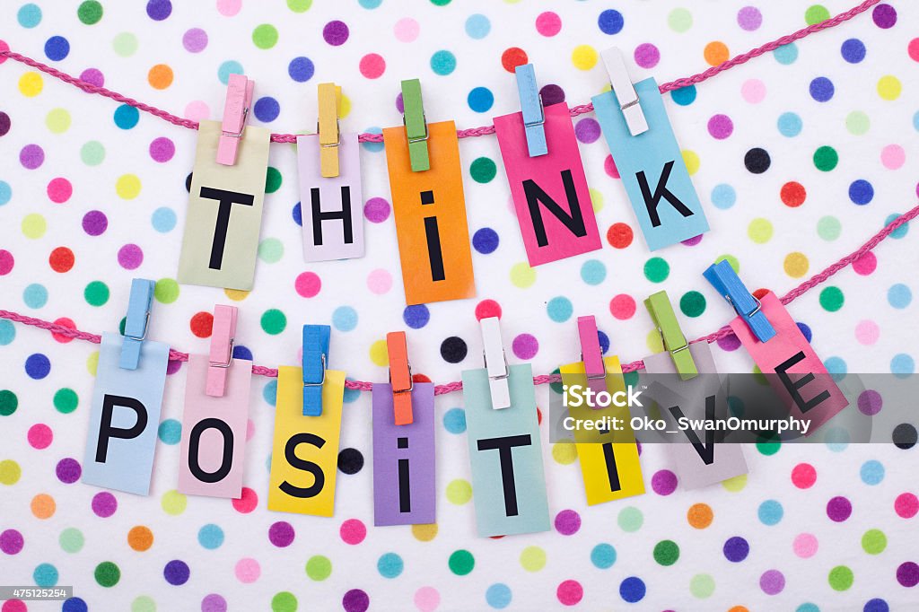 Think Positive Colorful cheerful think positive message on colorful dots background 2015 Stock Photo