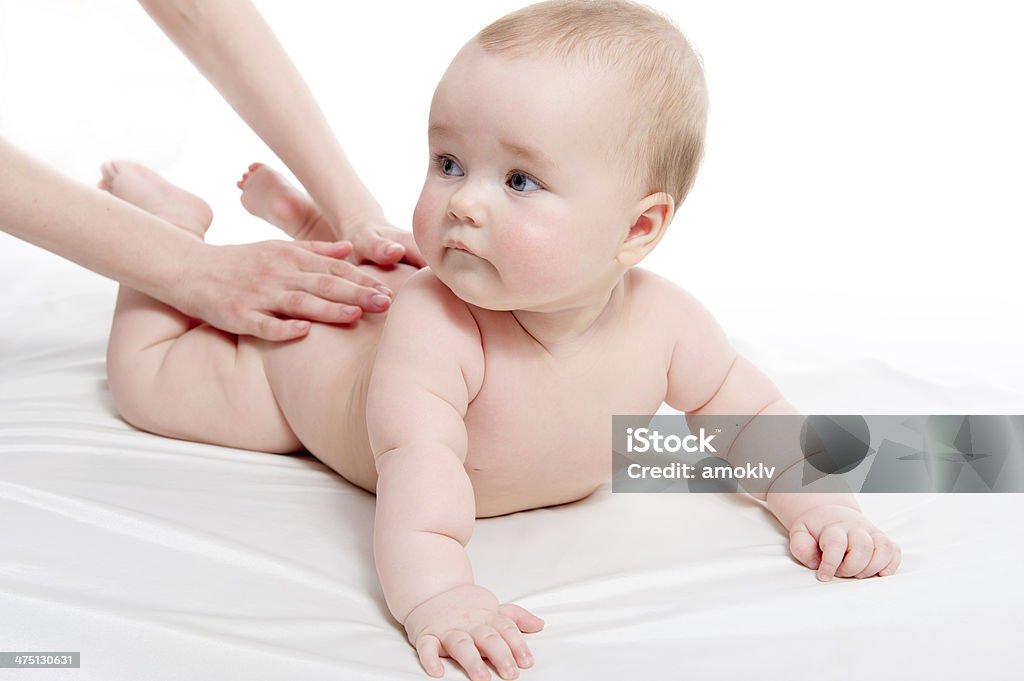 Mother massaging her lovely baby Baby - Human Age Stock Photo