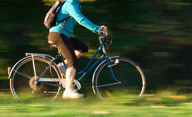 istock Lady Cycling in the Park 475131429