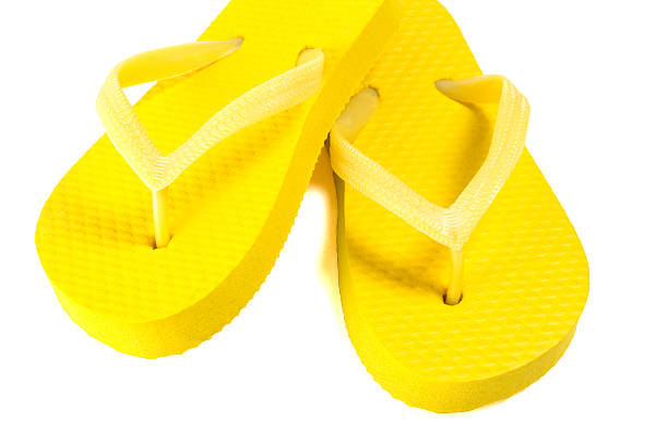 istock yellow summer flip flop shoes isolated on white 475132472