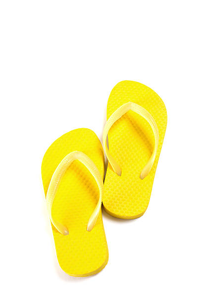 istock yellow summer flip flops isolated on white 475132998