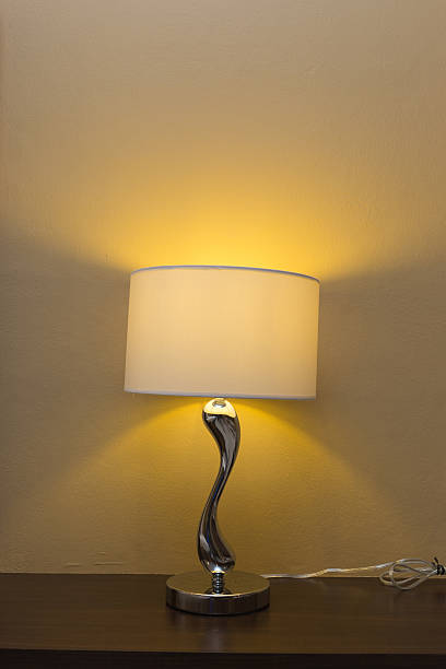 istock electricity lamp on wood table bedside 475133172