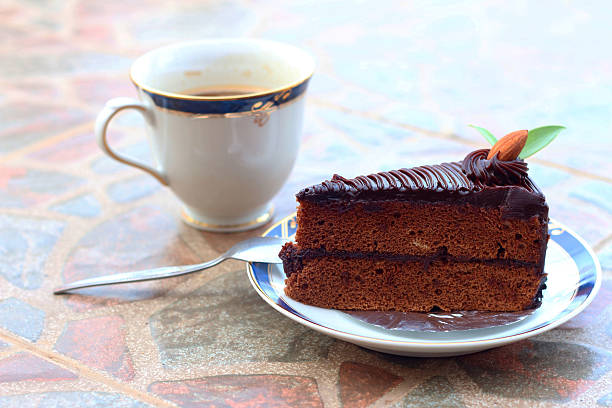 istock chocolate cake with a cup of coffee. 475133430
