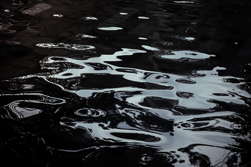 Abstract view of apartment buildings reflected in water