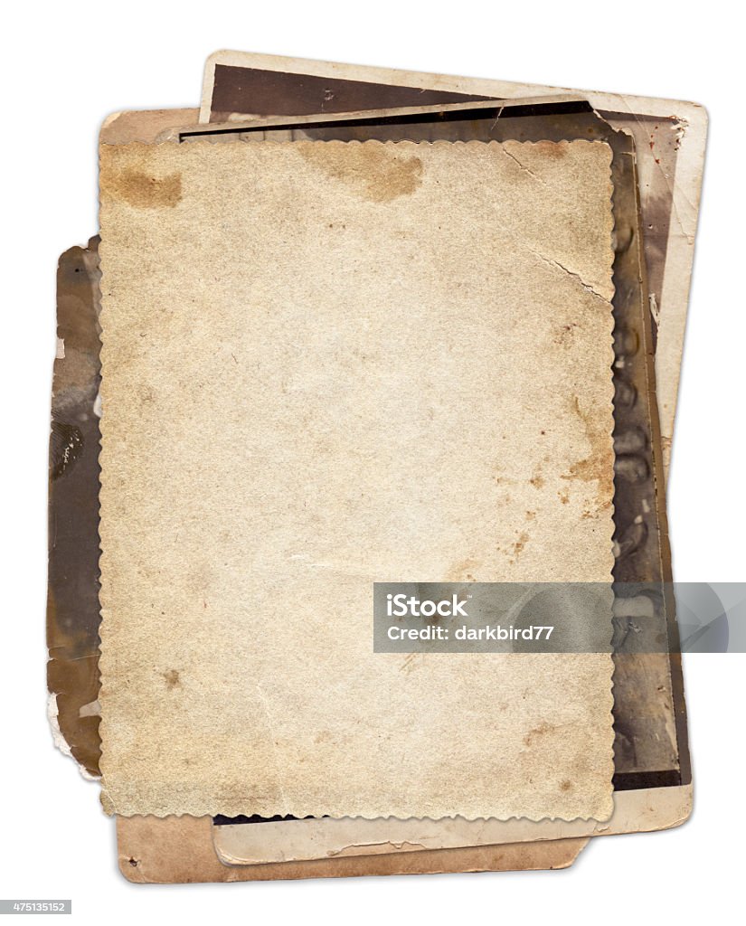 Stack of old vintage photos with stains and scratches Stack of old vintage photos with stains and scratches background isolated Old Stock Photo