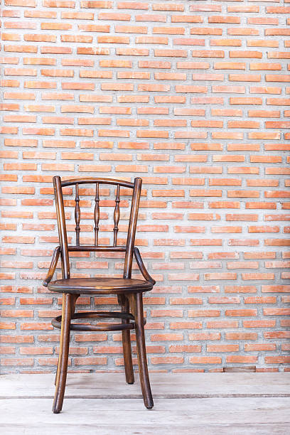 istock Wood Chair with against a Wall 475135616