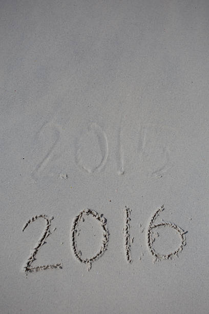 istock Numbers 2016 on beach - concept holiday background 475138788