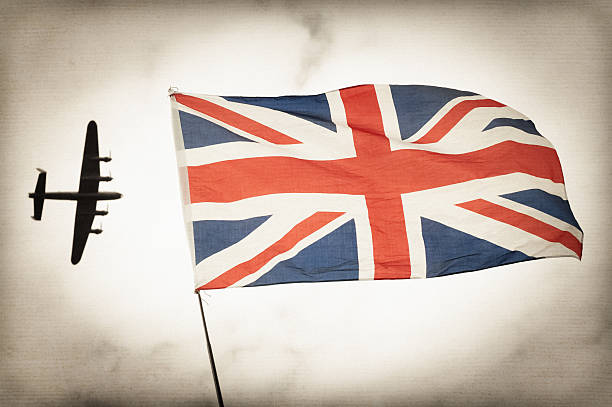 Battle of Britain Vintage toned bomber aircraft and British Union flag Battle of Britain concept. airshow photos stock pictures, royalty-free photos & images