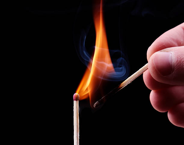istock Ignition of a match, with smoke on dark background 475149156