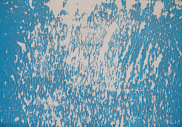 Peeling paintPeeling of blue painting on wall
