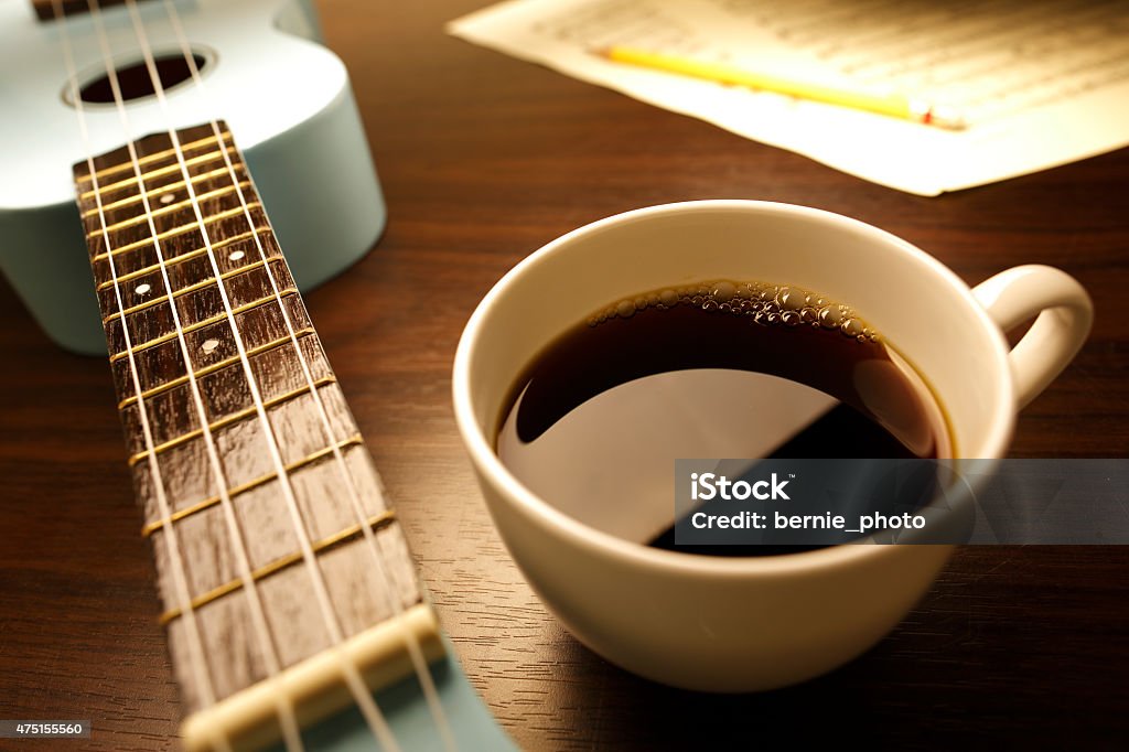 Create music Coffee with Ukulele and score on the table Drink Stock Photo