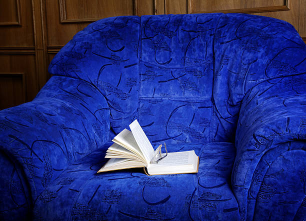 istock Interior with an armchair and the open book 475157601