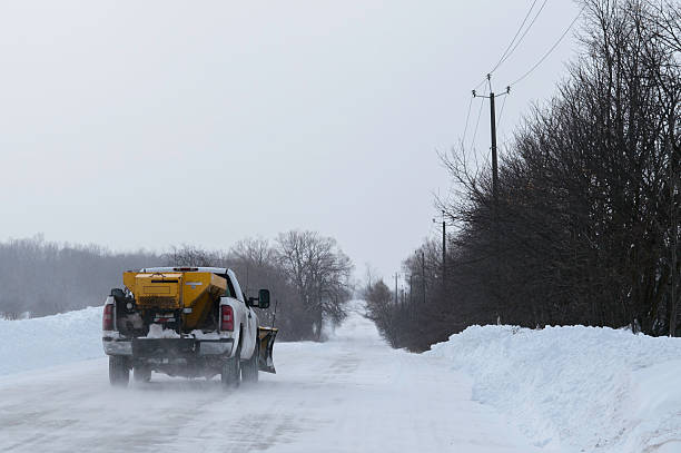 Plough Truck going down Snowy Road