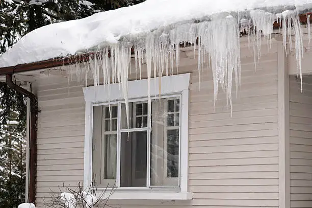 Photo of Icicles Hanging from House Eavestrough