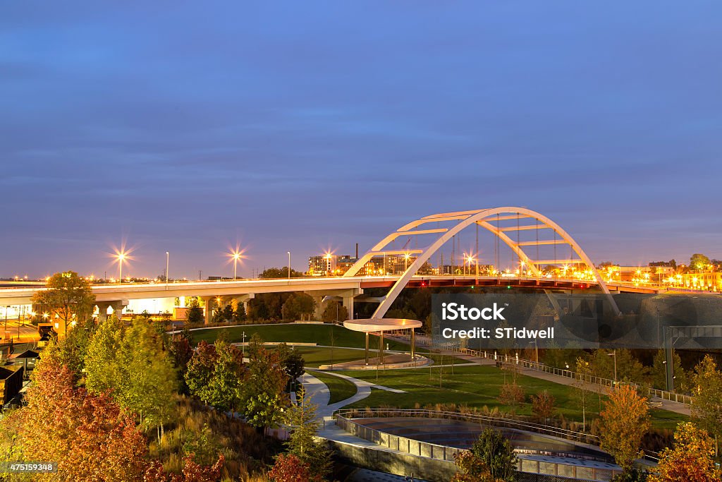 Nashville bridge with blurred car lights Nashville city  Bridge over park at sunset with traffic lights and an arch that is illuminated by the sunlight. Nashville Stock Photo