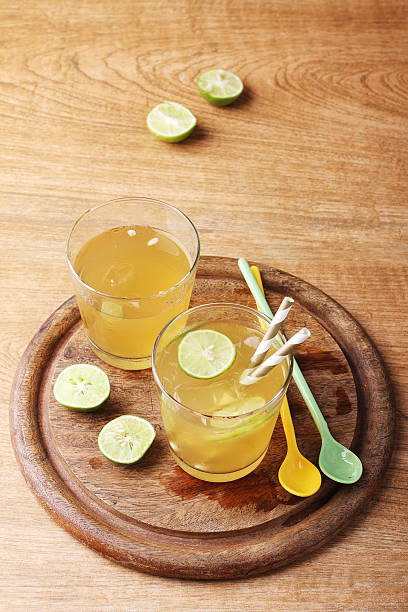 istock cold gold soft drink from lime and honey 475160142