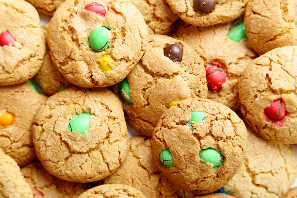 istock Cookies with colorful candy background 475160198