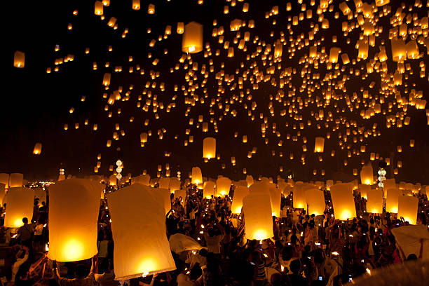 istock launching sky lanterns in Loy Krathong  Festival 475160394