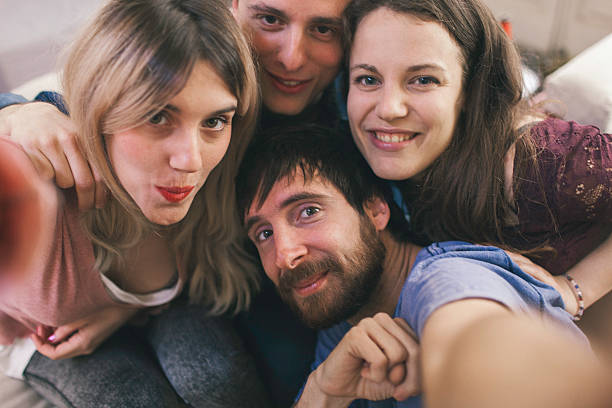 istock Friends making a selfie with a smartphone. 475162202