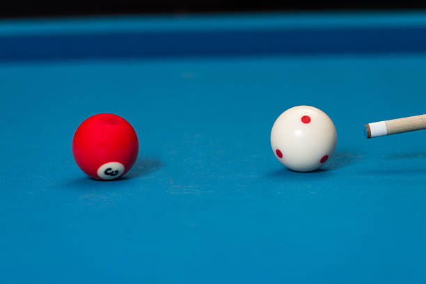 istock Man Playing Pool About to Hit Ball 475163229
