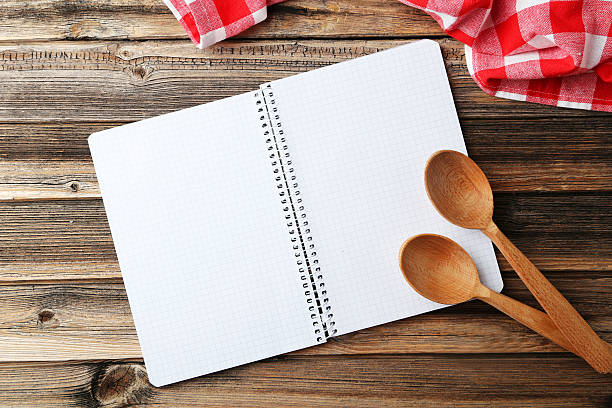 istock Open blank recipe book on brown wooden background 475163382