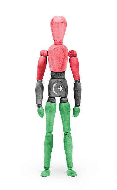 istock Wood figure mannequin with flag bodypaint - Libya 475172672