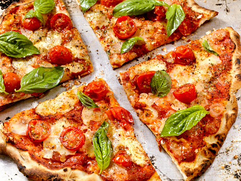 Margherita Pizza with Fresh Mozzarella,Tomatoes and Basil - Photographed on a Hasselblad H3D11-39 megapixel Camera System