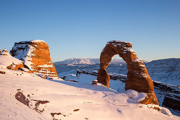istock Delicate Arch at sunset in Winter 475176741
