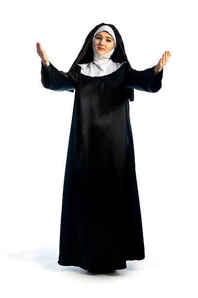 blessing pose Full growth photo of young  nun in blessing pose. Photo on white background. nun catholicism sister praying stock pictures, royalty-free photos & images